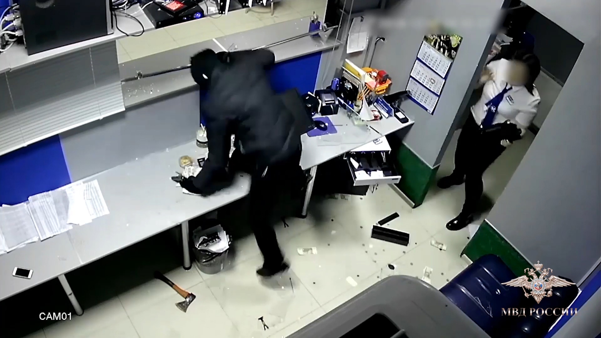 Read more about the article Armed Robber Smashes Bookies Security Screen With Axe