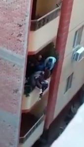 Read more about the article Woman Clings On After Hubby Pushes Her Over Balcony