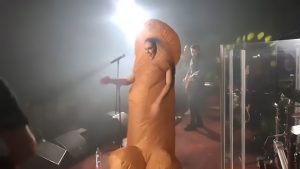 Read more about the article Female Pop Star Shocks Fans With Giant Penis Costume