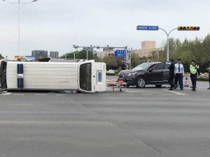 Read more about the article Ambulance Flips At Crossroads As SUV Rams It