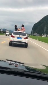 Read more about the article Two Girls Play On BMW Roof As It Drives On Motorway