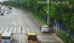 Read more about the article Lucky Kid Dodges Fast-Moving Car By Inches At Crossing