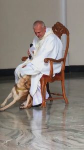 Read more about the article Priest Laughs As Dog Wants To Play During Church