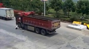 Read more about the article Moped Fall Woman Rolls To Dodge Lorry Wheel At Last Sec