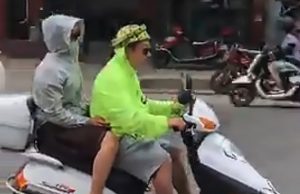 Read more about the article Chinese Biker Uses Watermelon Rind As Safety Helmet