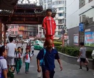 Read more about the article Kung Fu 6yo Balances While Standing On Gramps Shoulders