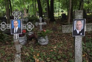 Read more about the article Pair Collared For Ghoulish Putin Photo On Grave