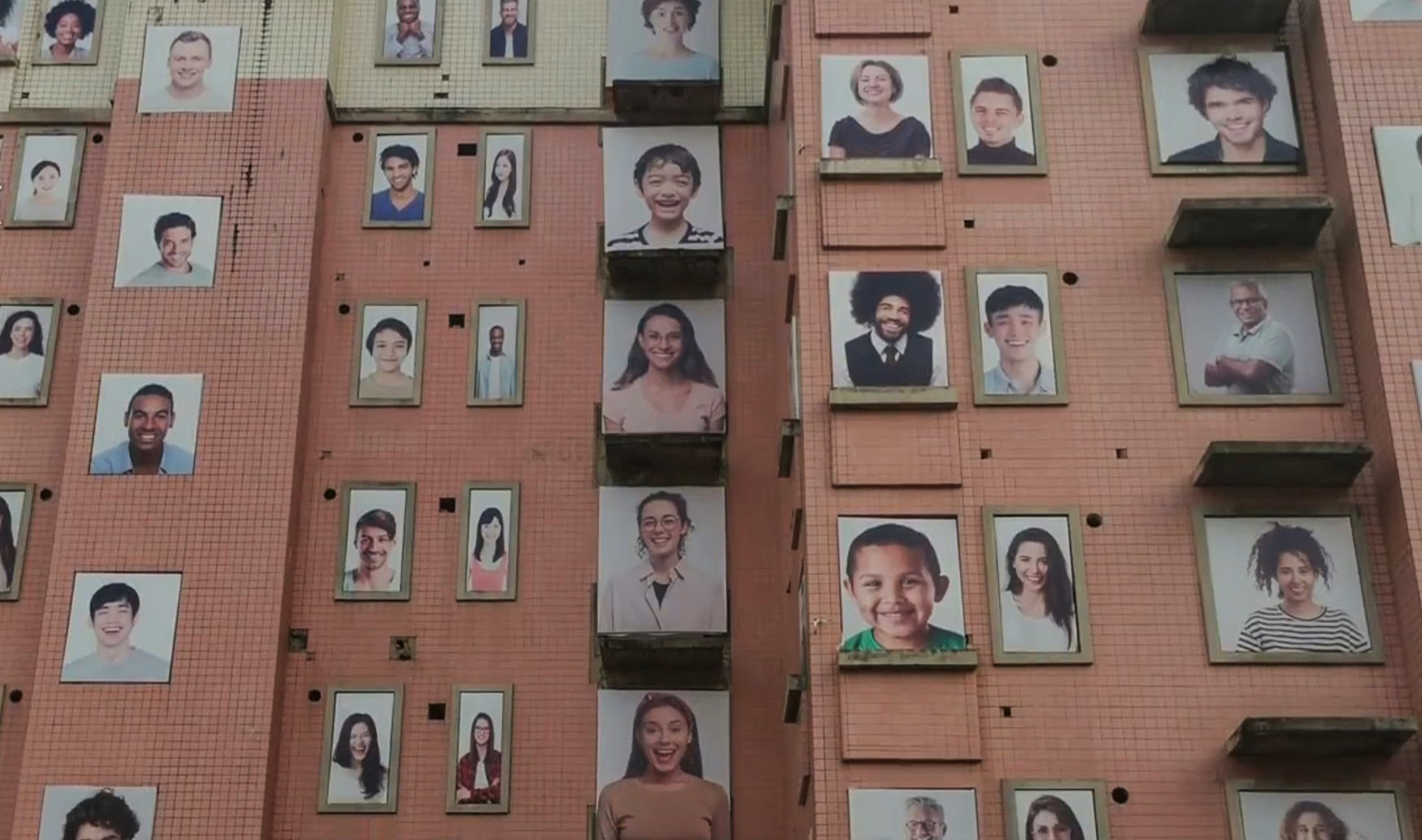 Read more about the article Residents Spooked As Building Covered In Eerie Portraits