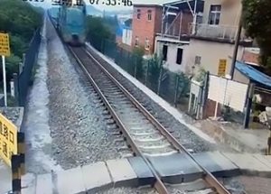 Read more about the article Scooter Rider Sent Flying By Speeding Train Survives