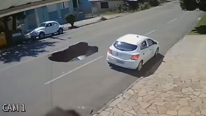 Read more about the article Woman Drives Into Huge Sinkhole In Road