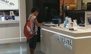 Read more about the article Kid Does Homework On Display Model In Samsung Shop