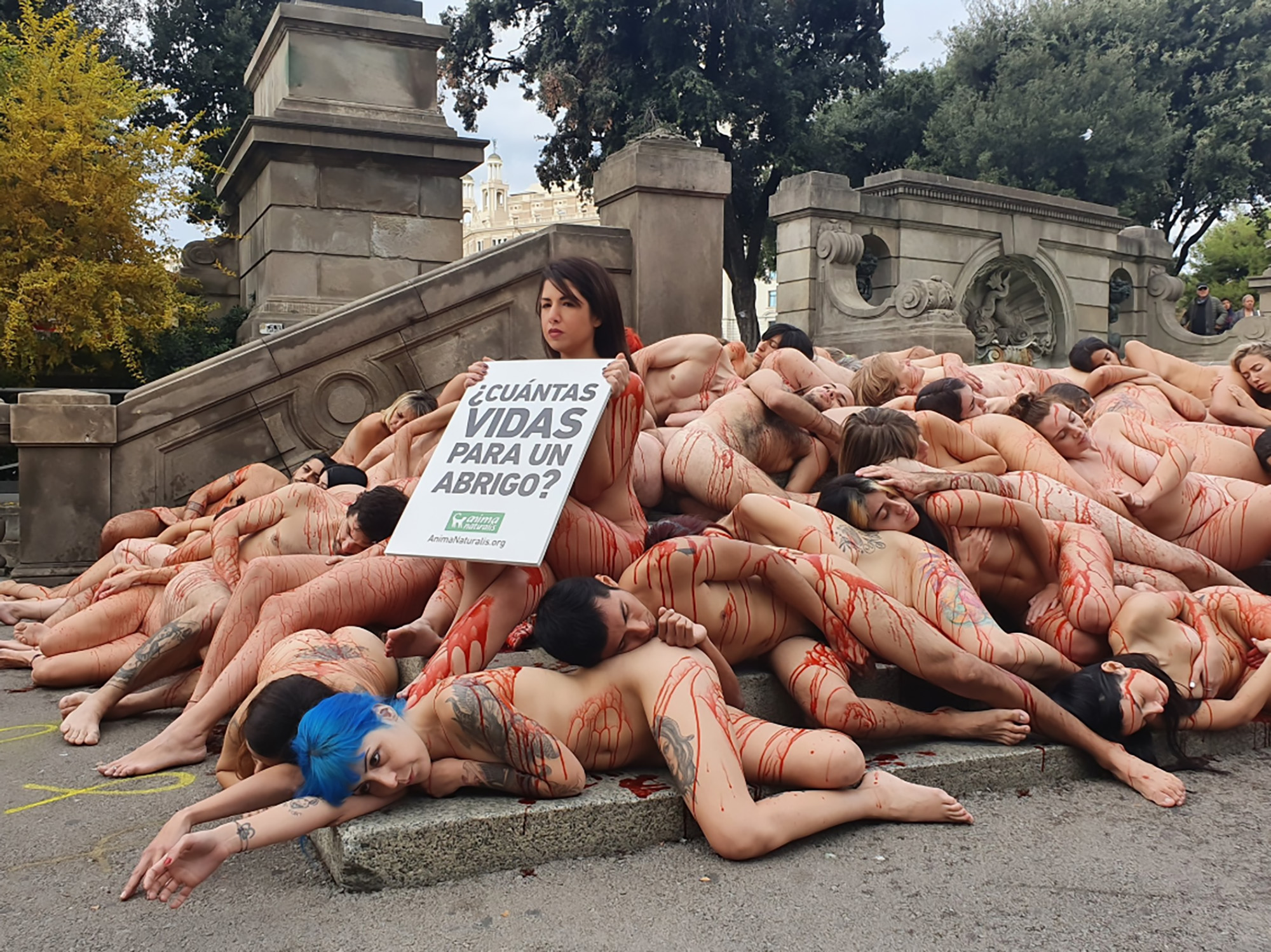 Read more about the article Bloodied Activists In Naked Barcelona Fur Trade Protest