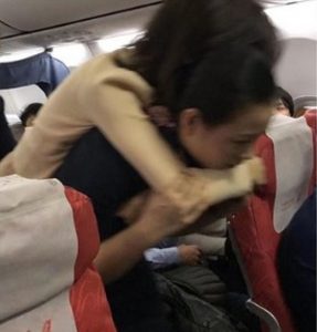 Read more about the article Female Flight Attendant Carries Sick Passenger On Back