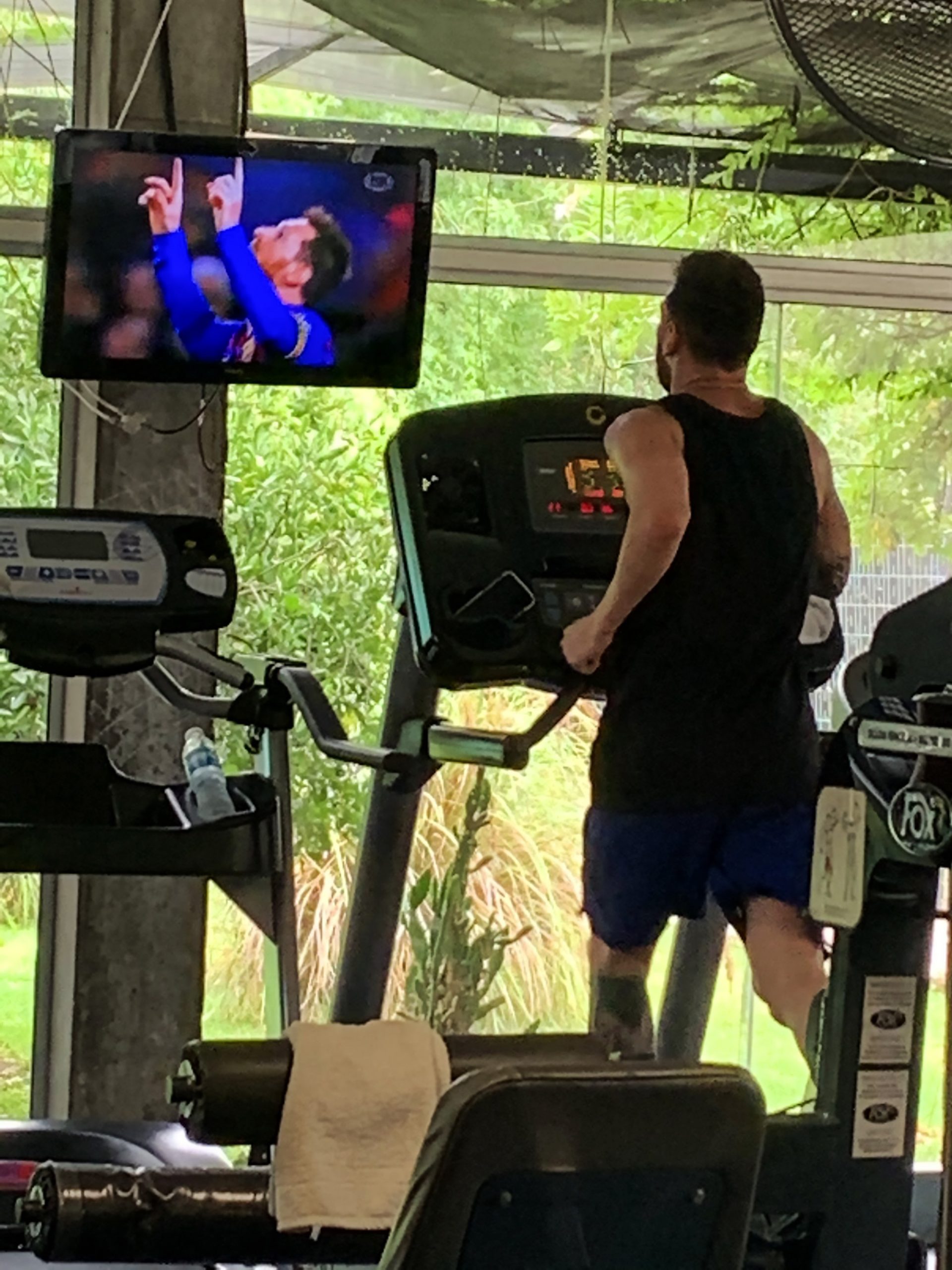 Read more about the article Messi Snapped In Gym Watching His Highlights On TV