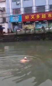 Read more about the article Locked-Down OAP In Pants Swims Across River