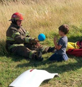 Read more about the article Firefighters Play Ball With Child In Motorway Pileup