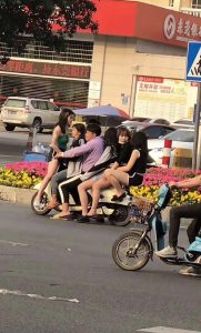 Read more about the article Casual Rider Carries 5 Women On Small Scooter