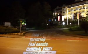 Read more about the article Light Show Protest At Thai Kings Plush German Hotel