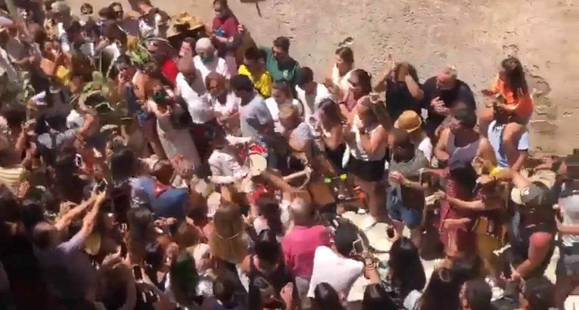 Read more about the article Anger As Unmasked Revellers Party In Spanish Street