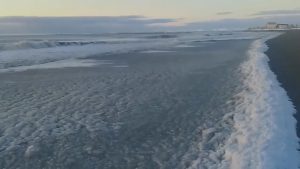 Read more about the article Waves Freeze On Shore Due To Extreme Cold