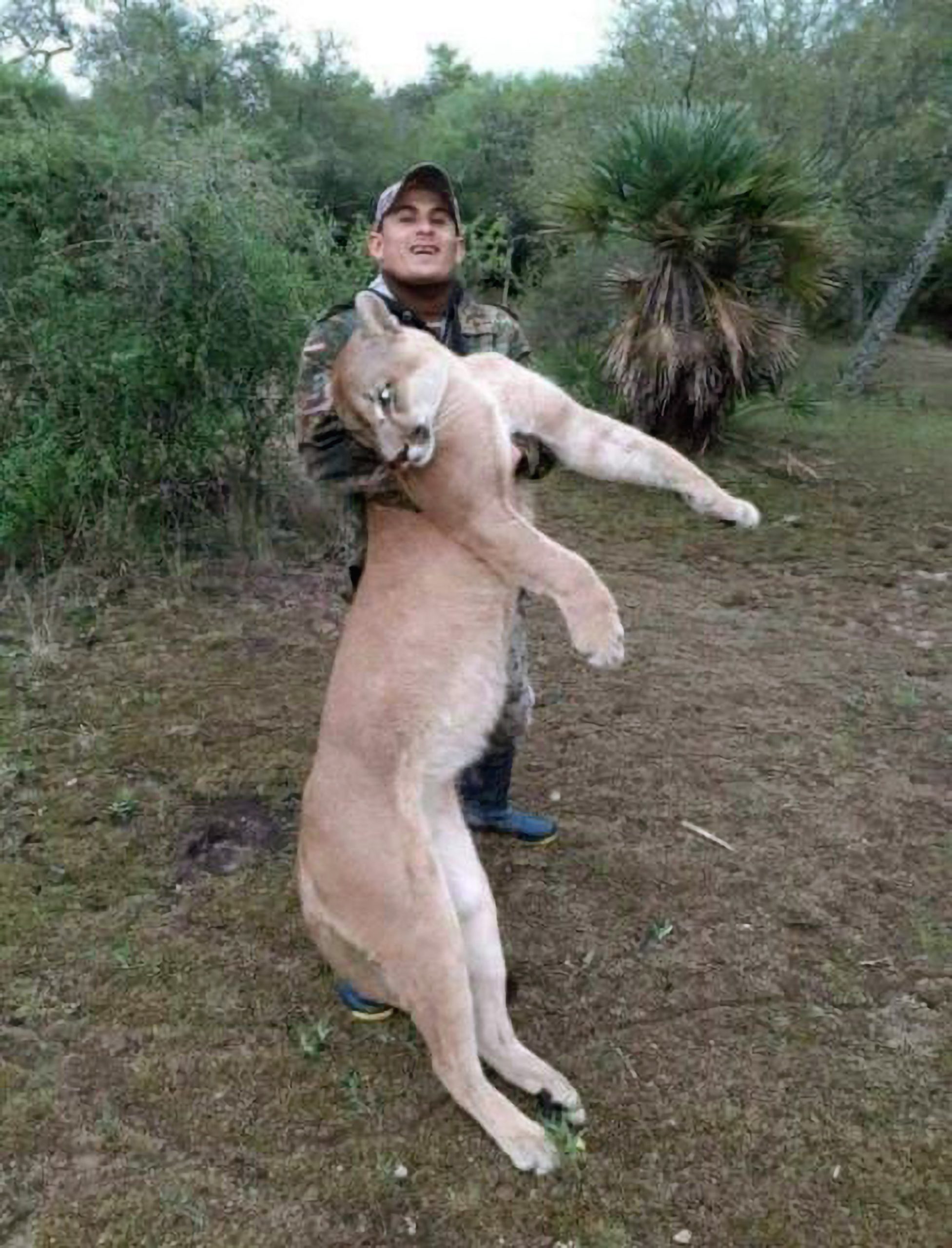Read more about the article Man Posing With Dead Puma He Hunted In Legal Hot Water