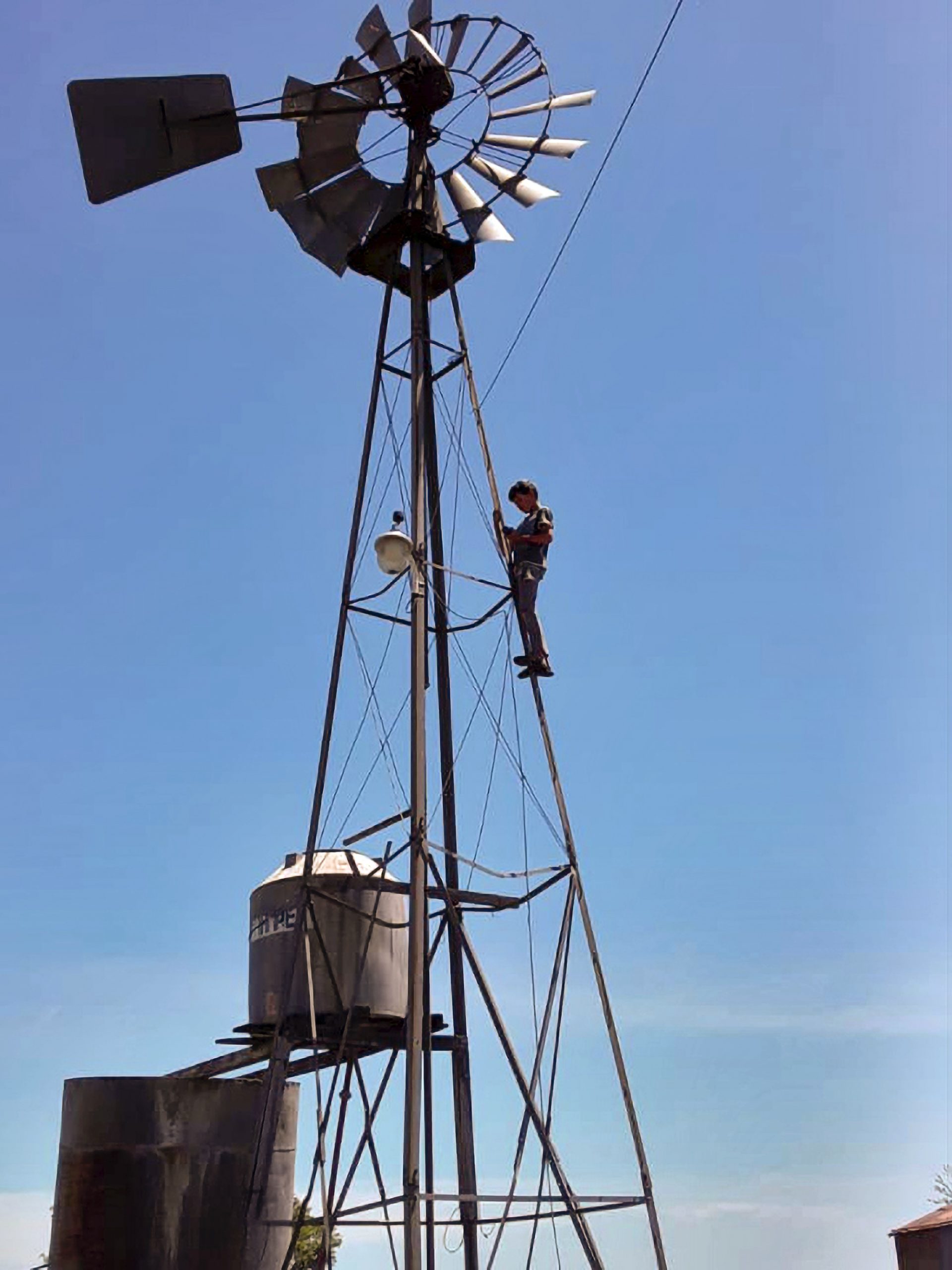 Read more about the article Rural Teen Risks Life Climbing Windmill To Send Homework