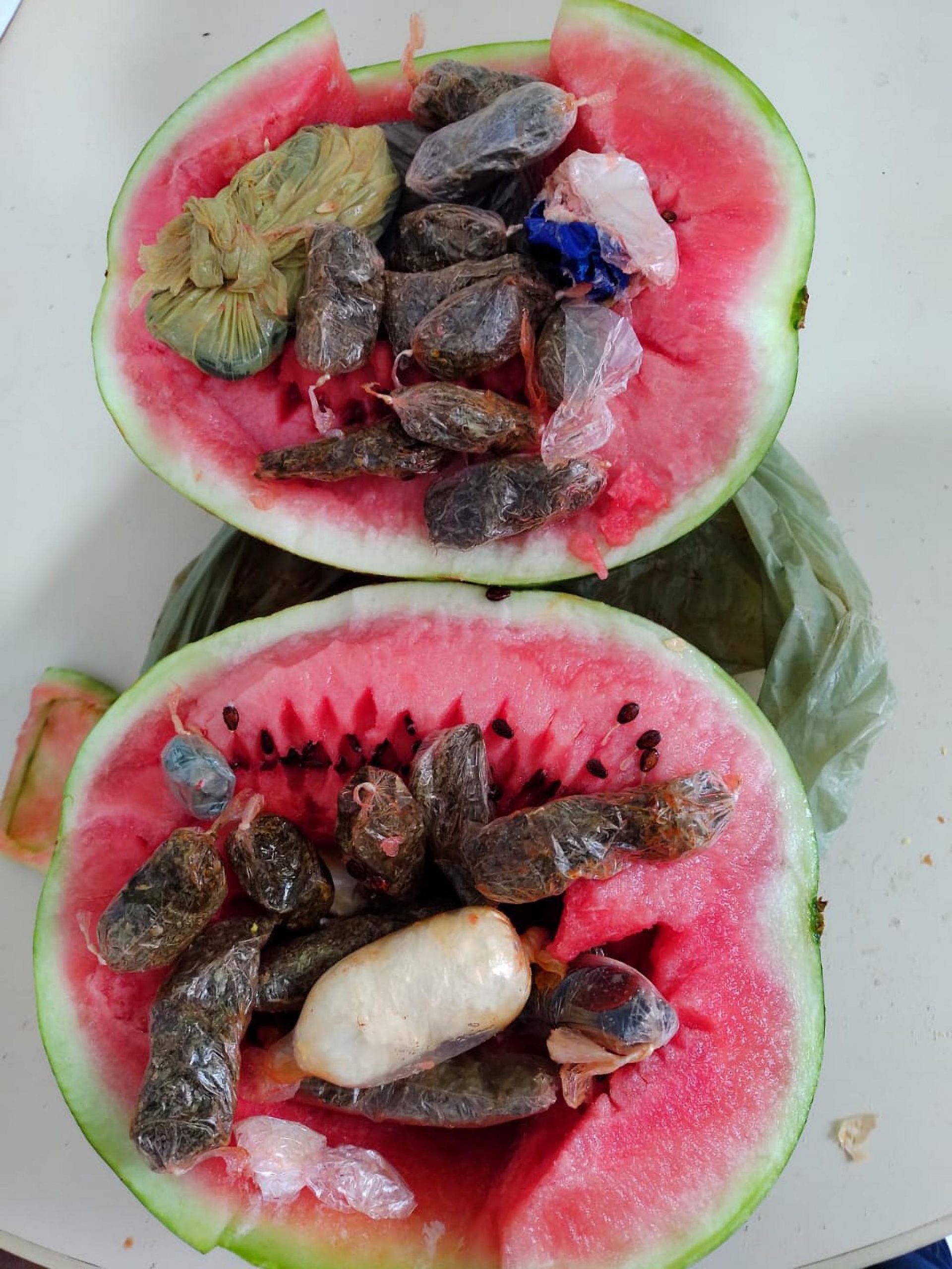 Read more about the article Woman Caught Smuggling Drugs Stashed In Watermelon Into Police Station