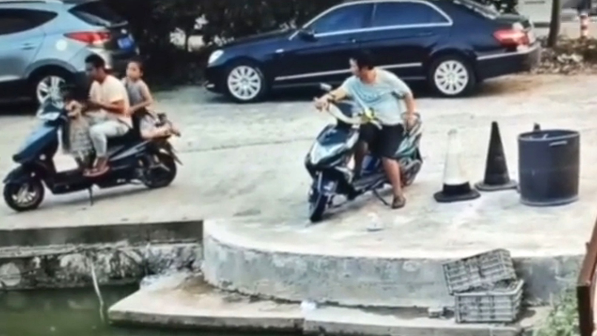 Read more about the article Moment Tot Twists Throttle On Dads Scooter Sending Family Of 3 Into River