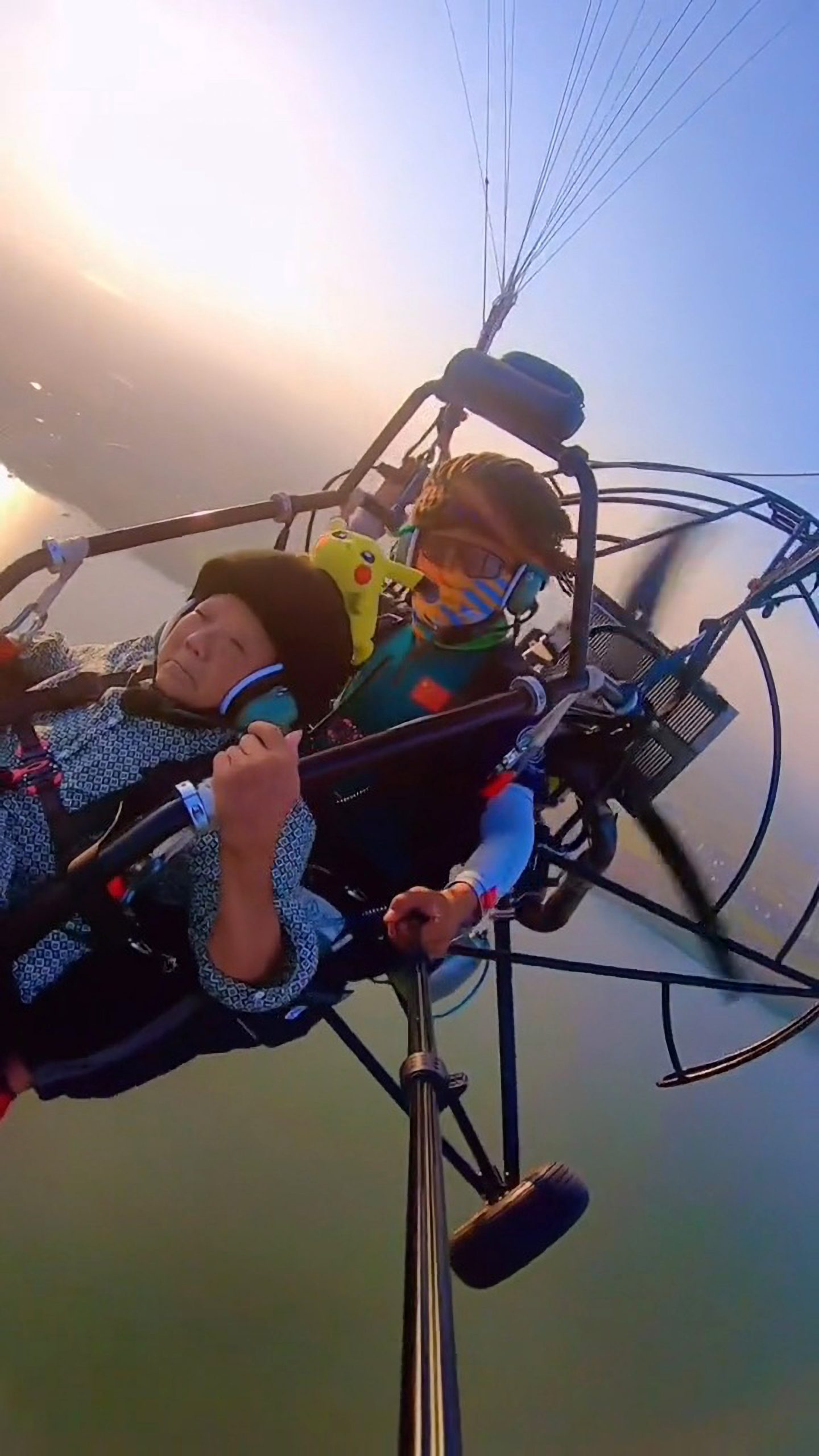 Read more about the article Touching Moment Grandmother, 83, Goes Paragliding Wearing Pikachu Hat