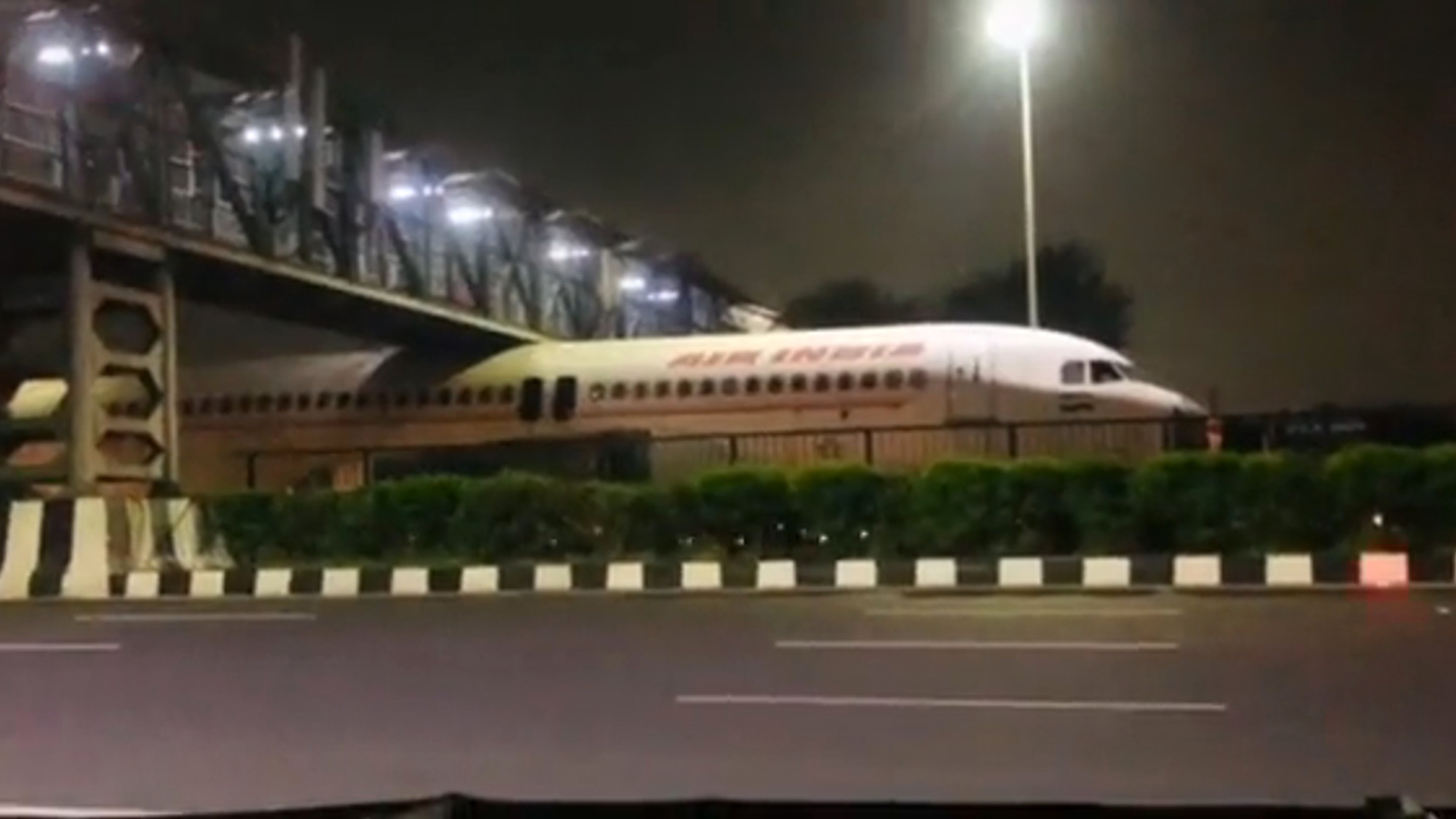 Read more about the article Air India Plane Wedged Between Footbridge And Motorway During Transportation