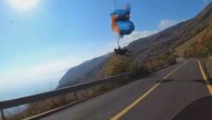 Read more about the article Biker Helps Trapped Paraglider After Finding Him Dangling From Power Lines Above Mountain Road