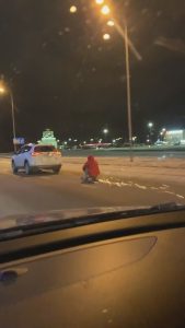 Read more about the article Sparks Fly As Daredevil Rides Snow Scooter Behind SUV On Motorway