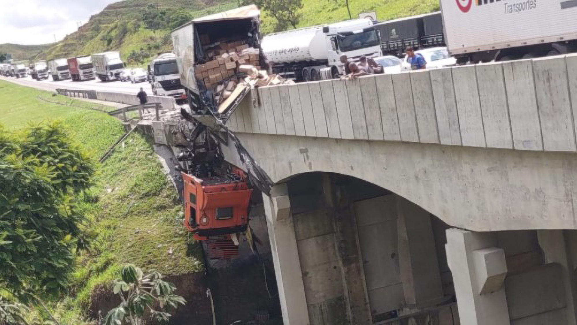Read more about the article Lorry Driver Dangles 26 Feet From Ground In Cab After Crashing Through Barrier During Pileup