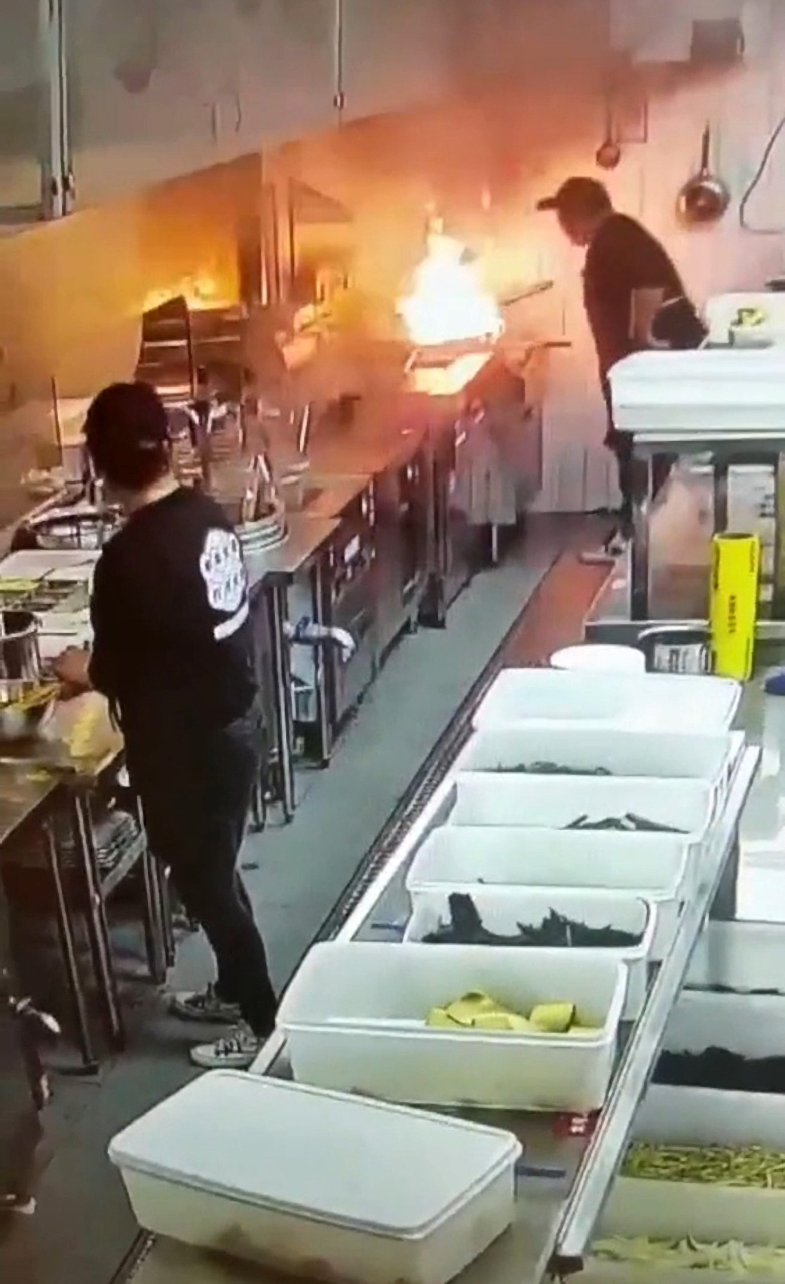 Read more about the article Moment Kitchen Worker Lowers Face Mask And Tries To Blow Out Oil Fire