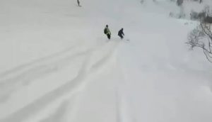 Read more about the article Moment Daredevil Snowboarder Is Buried Under Avalanche During Storm