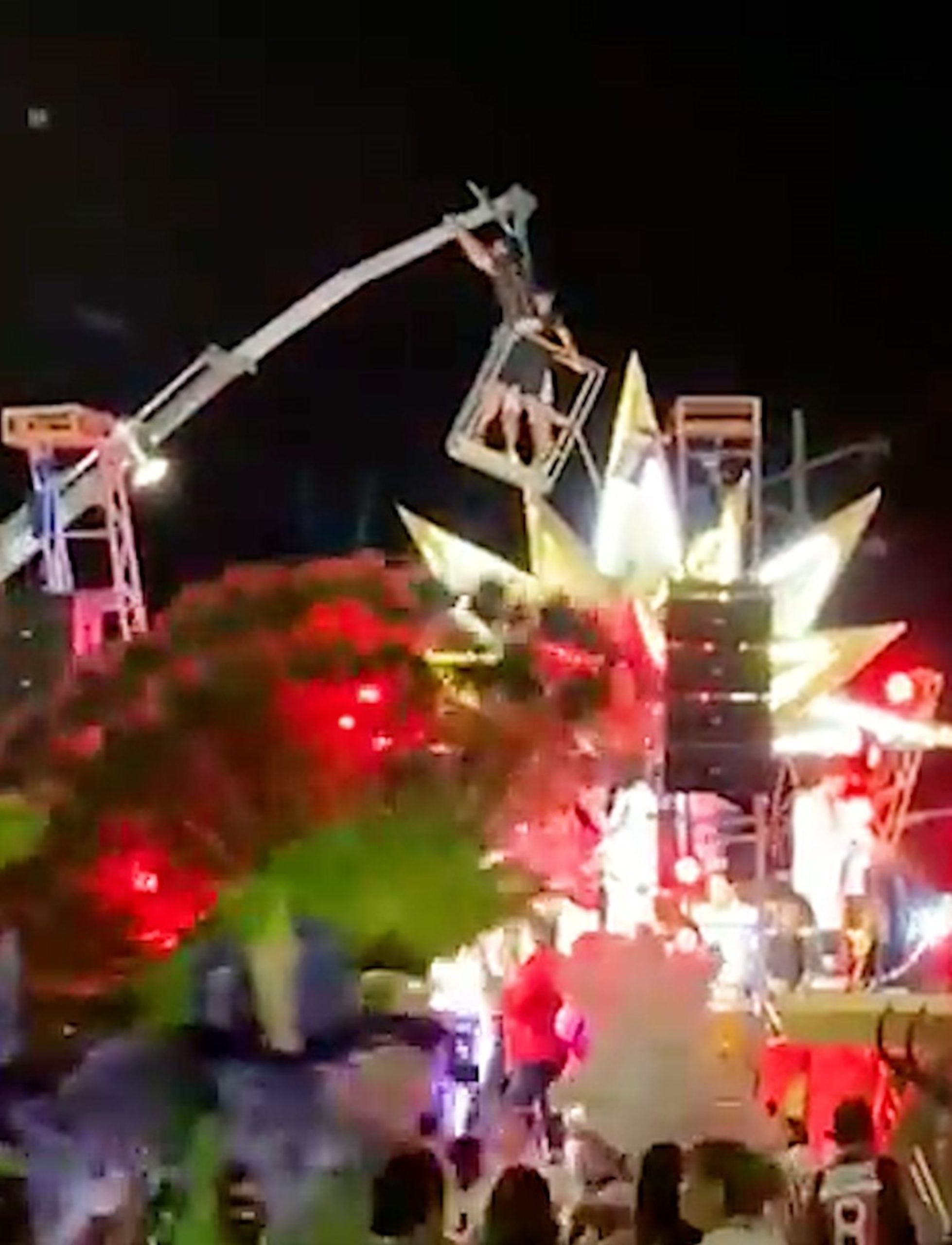 Read more about the article Shocking Moment Crane Collapses During Carnival Leaving Two Seriously Injured