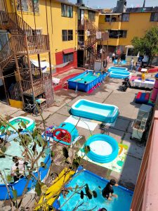 Read more about the article POOL PARTY: Parents Create Huge Water Park In Appartment Courtyard