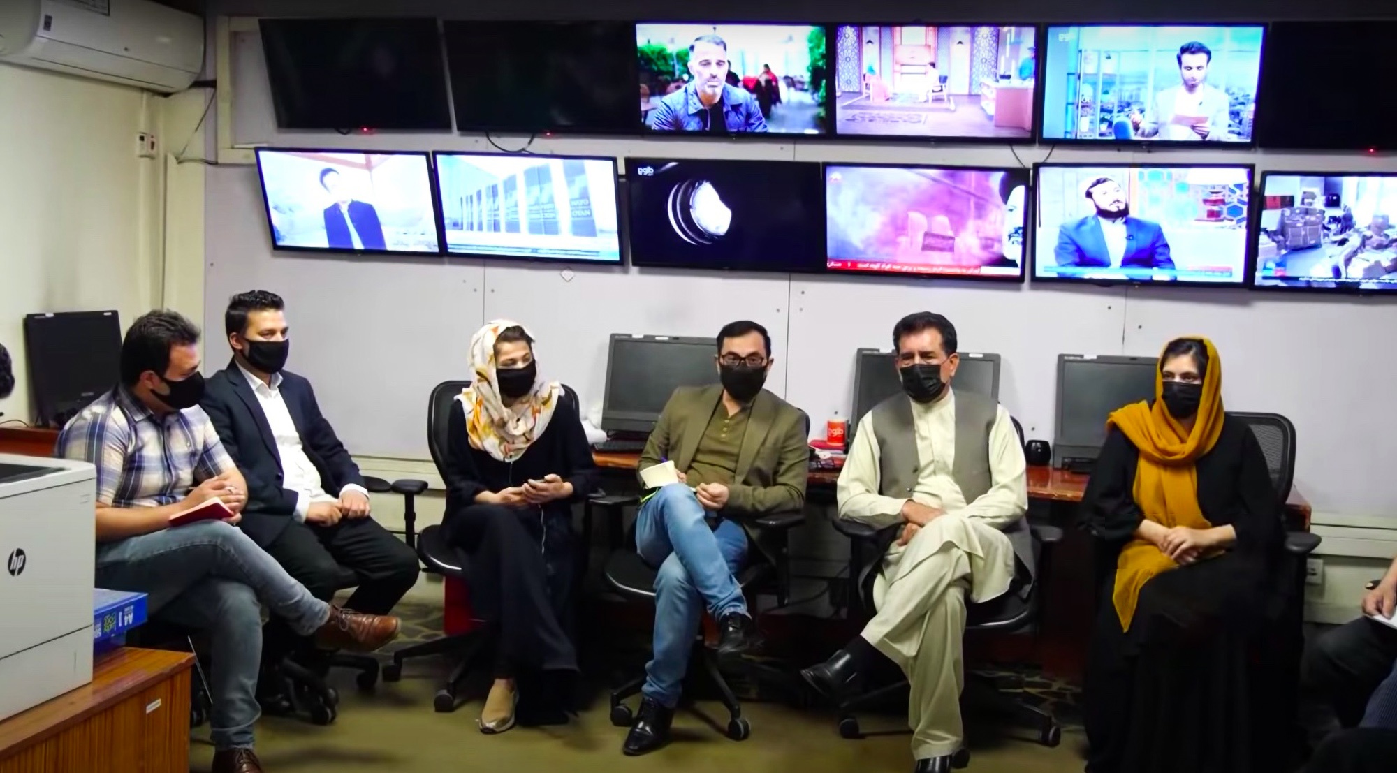 Read more about the article FACE OFF: Male Afghanistan Newsreaders Wear Masks To Take On Taliban