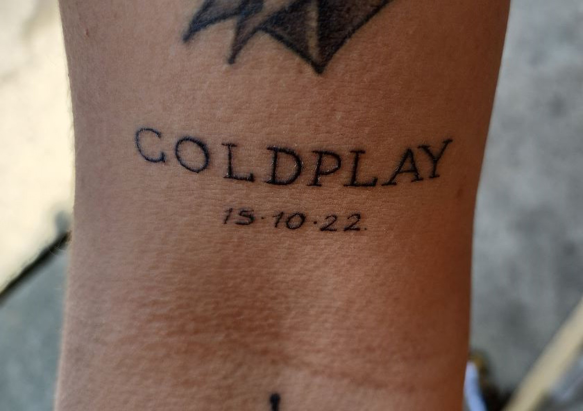 Read more about the article TATT’S OUT: Coldplay Mega Fan Tattoos Tour Date On Arm, Only For Gig To Be Postponed