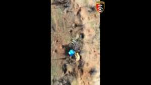 Read more about the article Moment Ukrainian Drone Drops Bombs On Russian Ammo Stashes Hidden In Dugouts And Foxholes
