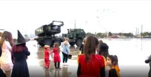 Read more about the article ARMED TO THE TEETH: US HIMARS Rocket Launcher Fires Trick Or Treat Sweets For Halloween Kids