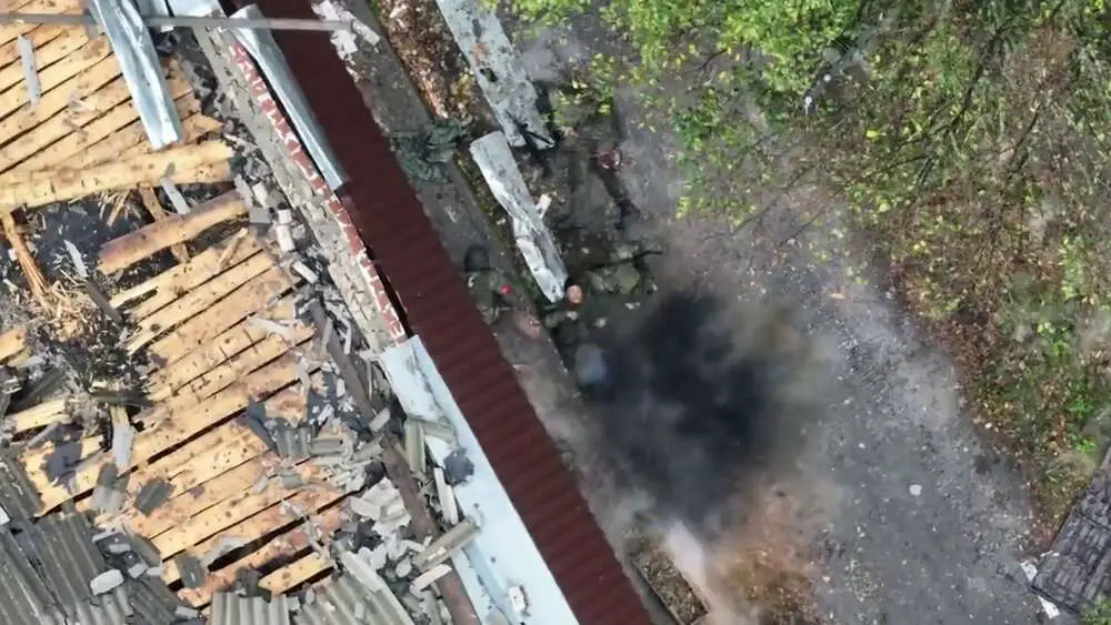 Read more about the article Moment Ukrainian Drone Drops Bomb On Group Of Russian Soldiers