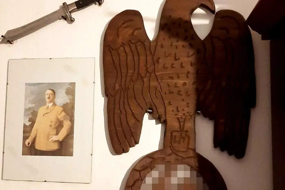 Read more about the article NEIGHBOURS FROM HEIL: Police Seize Guns And Nazi Shrine To Hitler In Raids On Hate Posters