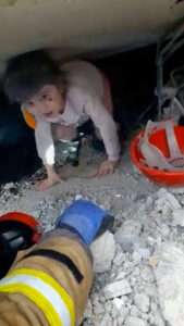 Read more about the article QUAKE RESCUE HERO: Rescuer Crawls Into Rubble To Save Little Girl Trapped Under Building