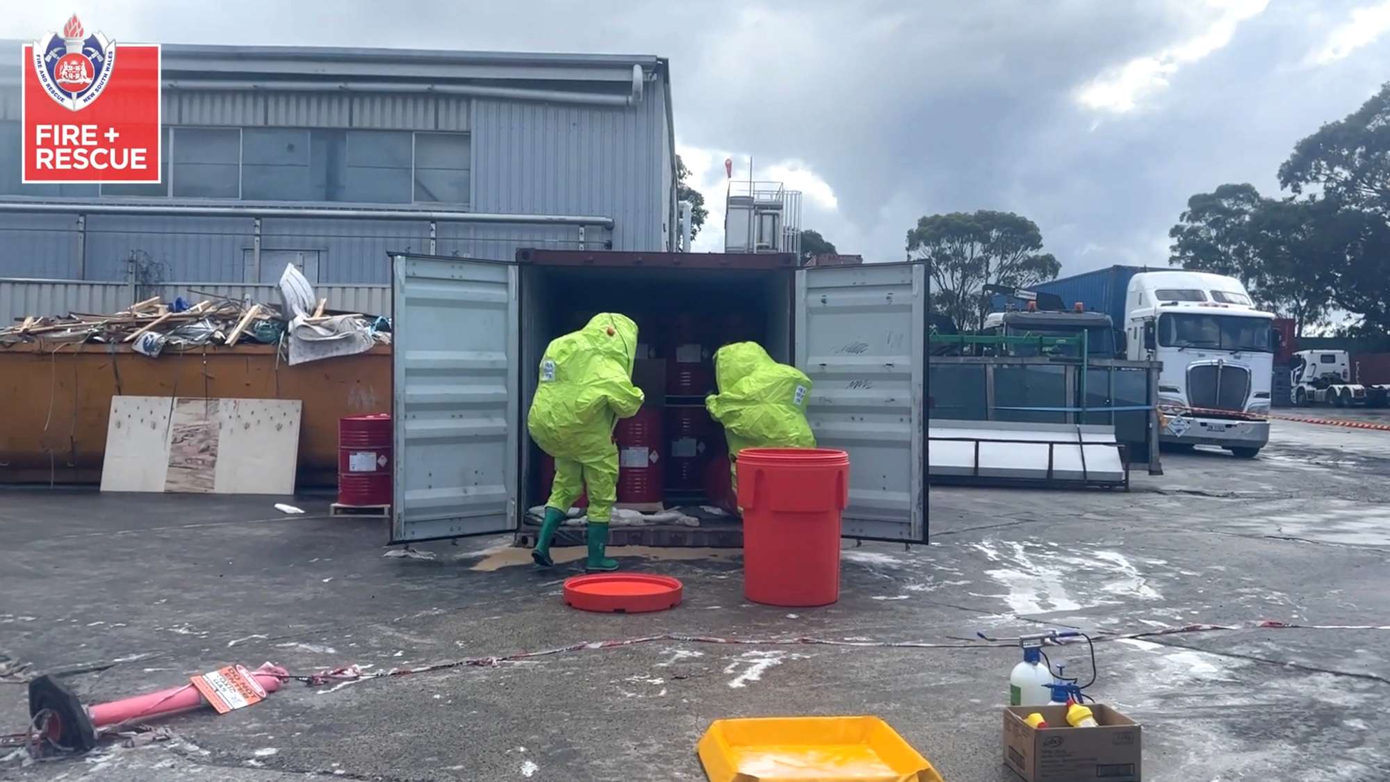 Read more about the article Firefighters In Hazmat Suits Clean Up Chemical Spill