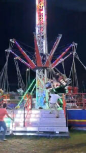 Read more about the article Terrifying Moment Chairs On Fairground Ride Swing Out Of Control