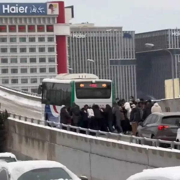 Passengers Work Together To Push Bus Uphill As It Kept Sliding Down Due To Heavy Snow