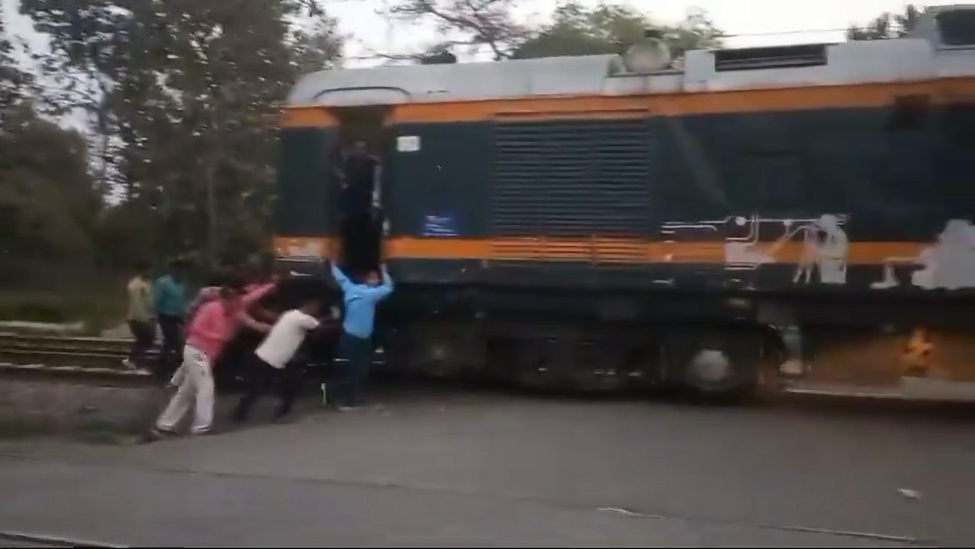 Read more about the article Railway Workers Push Broken Train Wagon Along Tracks As Stunned Onlookers Watch